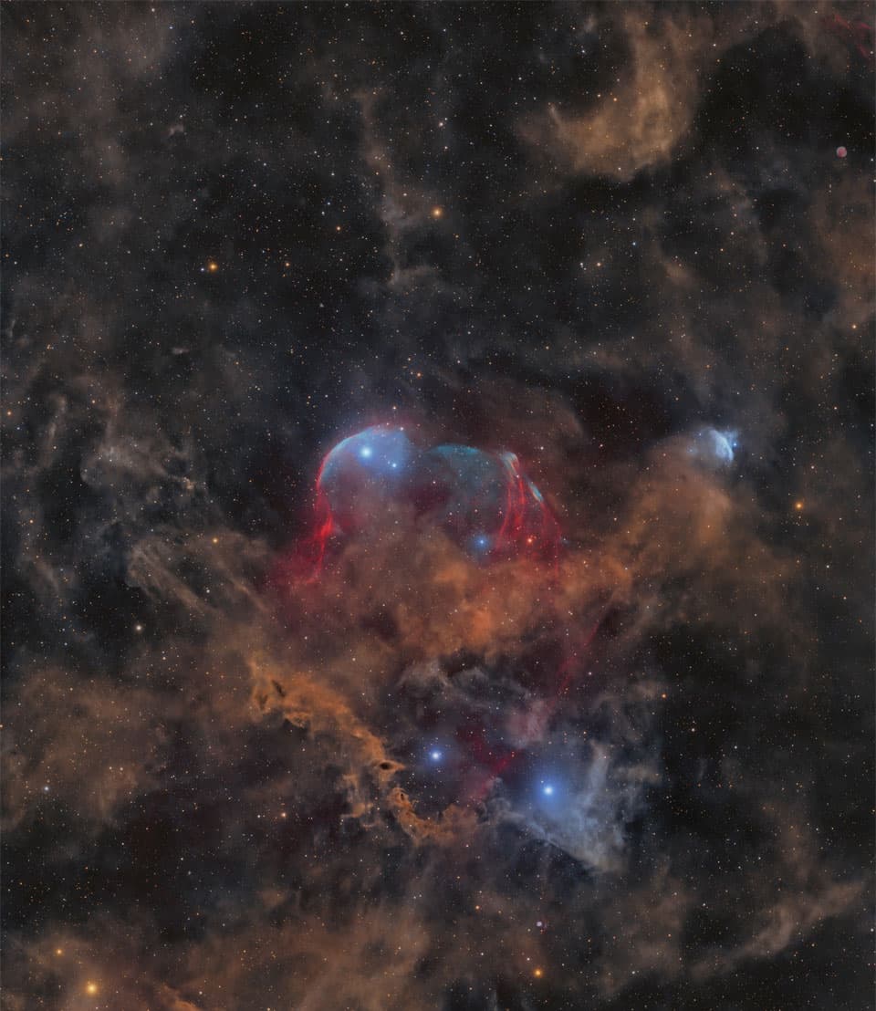 Between Scylla and Charybdis: A Double Cosmic Discovery