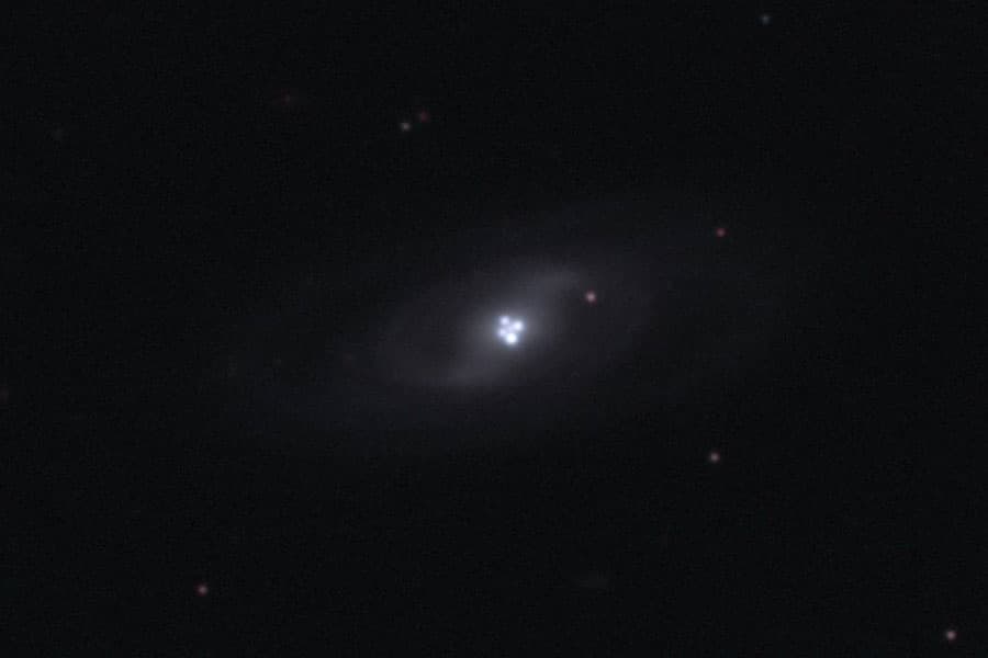 The Einstein Cross Gravitational Lens